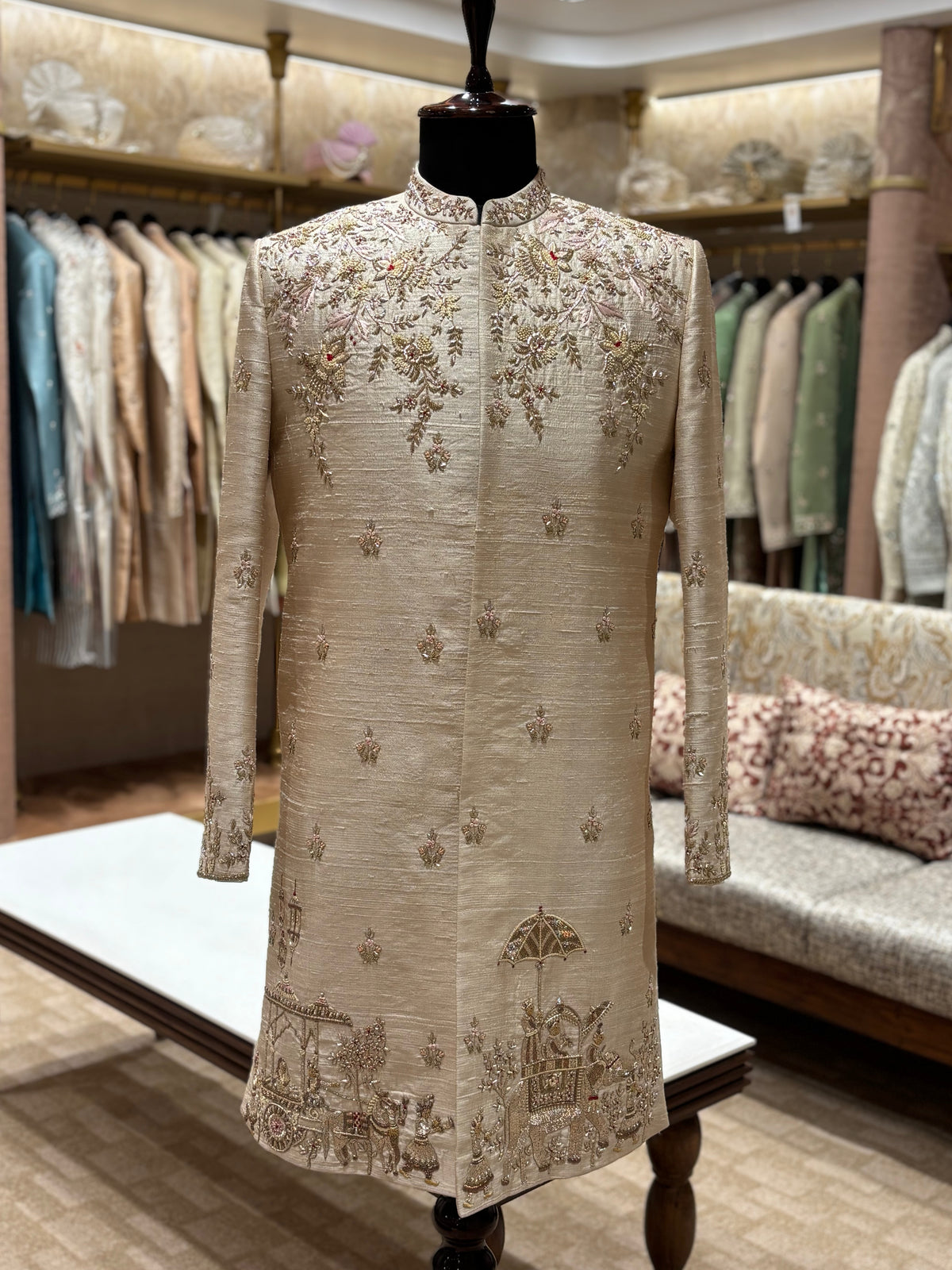The Rajavahana Sherwani in ivory beige with floral embroidery and royal procession-inspired detailing