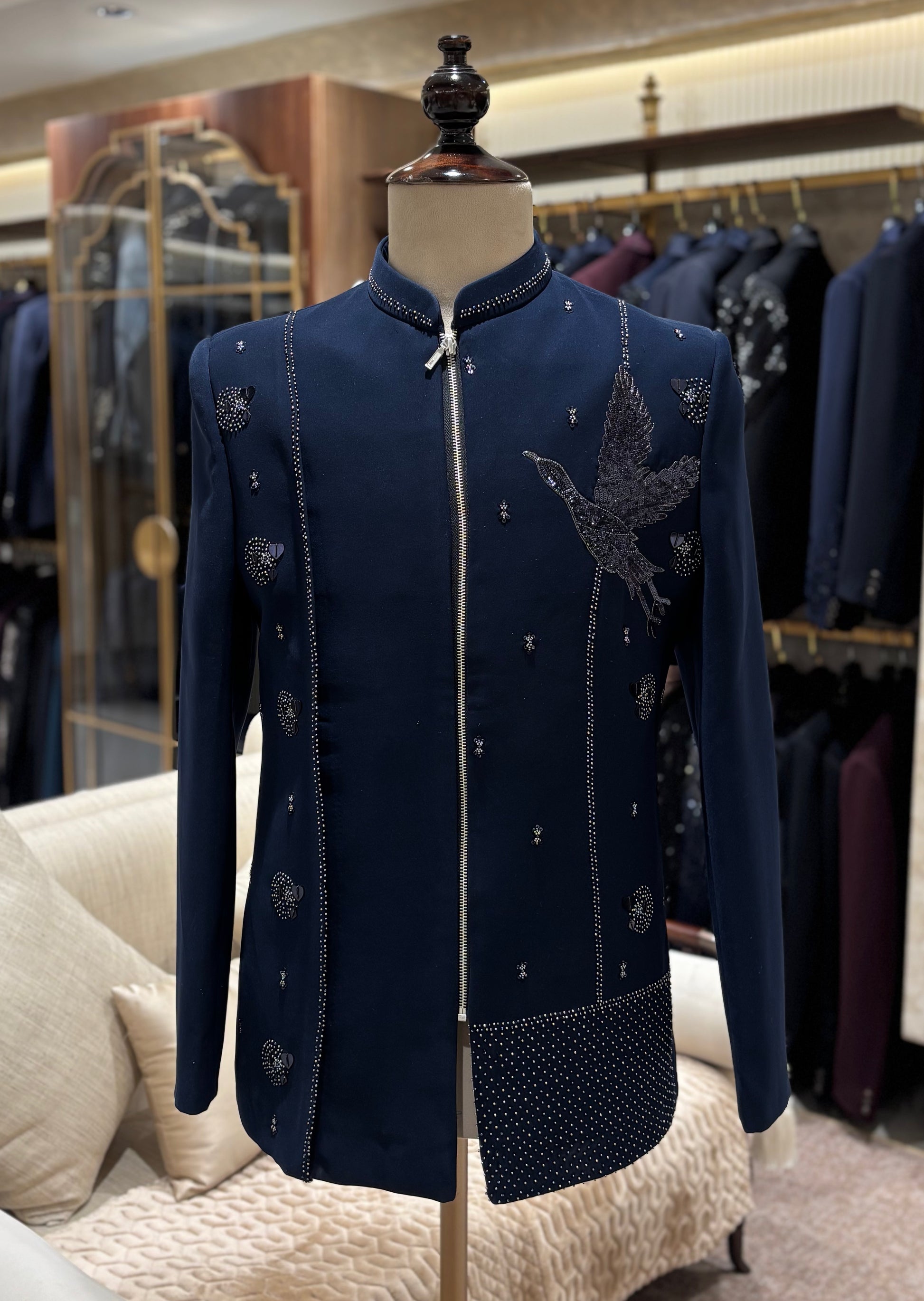 The Hamsavalli Jodhpuri in navy blue with a detailed flying bird motif and intricate embellishment