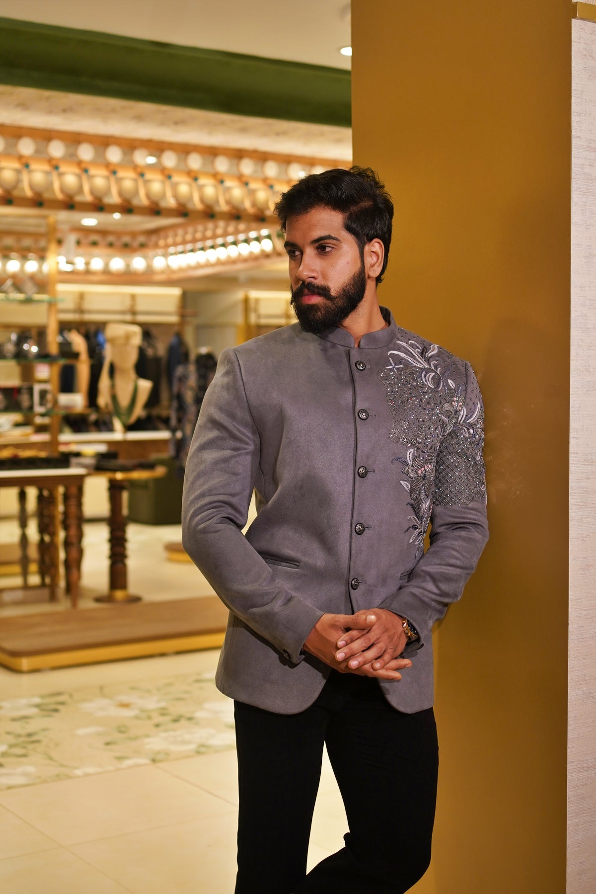 The Kadamba Jodhpuri in grey with intricate floral embroidery across the shoulder and sleeve