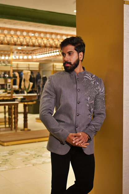 The Kadamba Jodhpuri in grey with intricate floral embroidery across the shoulder and sleeve